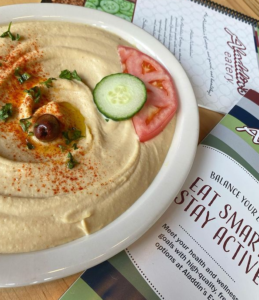 Hummus is a creamy blend of chickpeas pureed with tahini and lemon juice, drizzled with extra virgin olive oil.